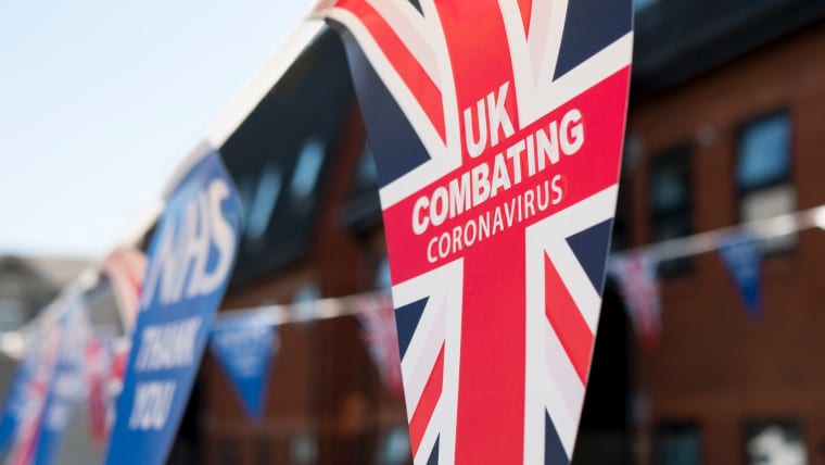 Union Jack that reads 'UK combating coronavirus'