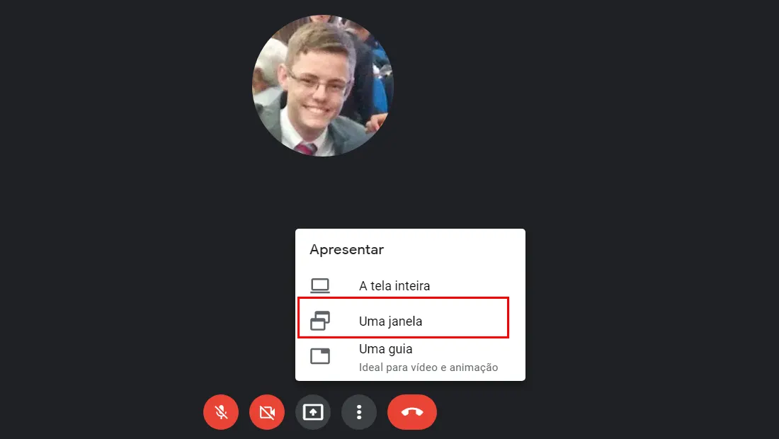 Aprenda como compartilhar tela no Google Meet e selecione a segunda opção